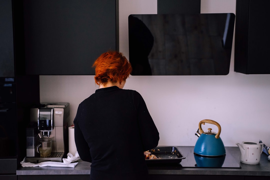 Chef Elena Vasquez in her kitchen, natural light streaming through windows